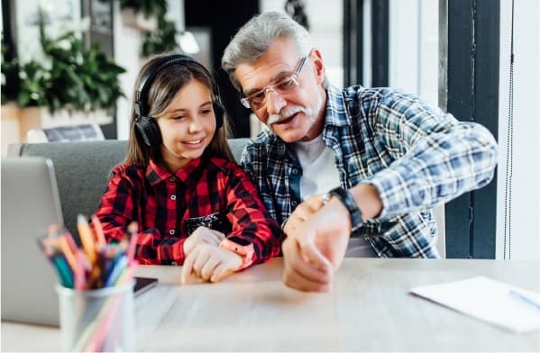 Grandparent showing something to grandchildren