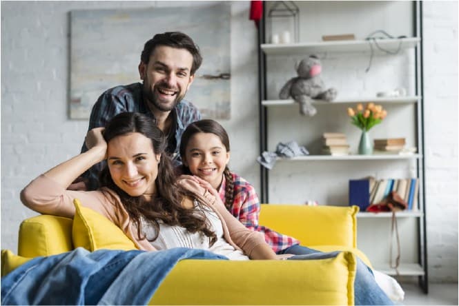 Happy family sitting on a sofa